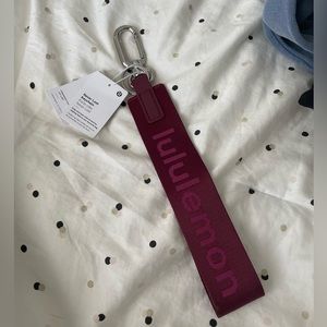 BRAND NEW lululemmon “never lost” keychain